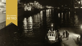 Schiffe im Bremer Überseehafen bei Nacht, 1962.